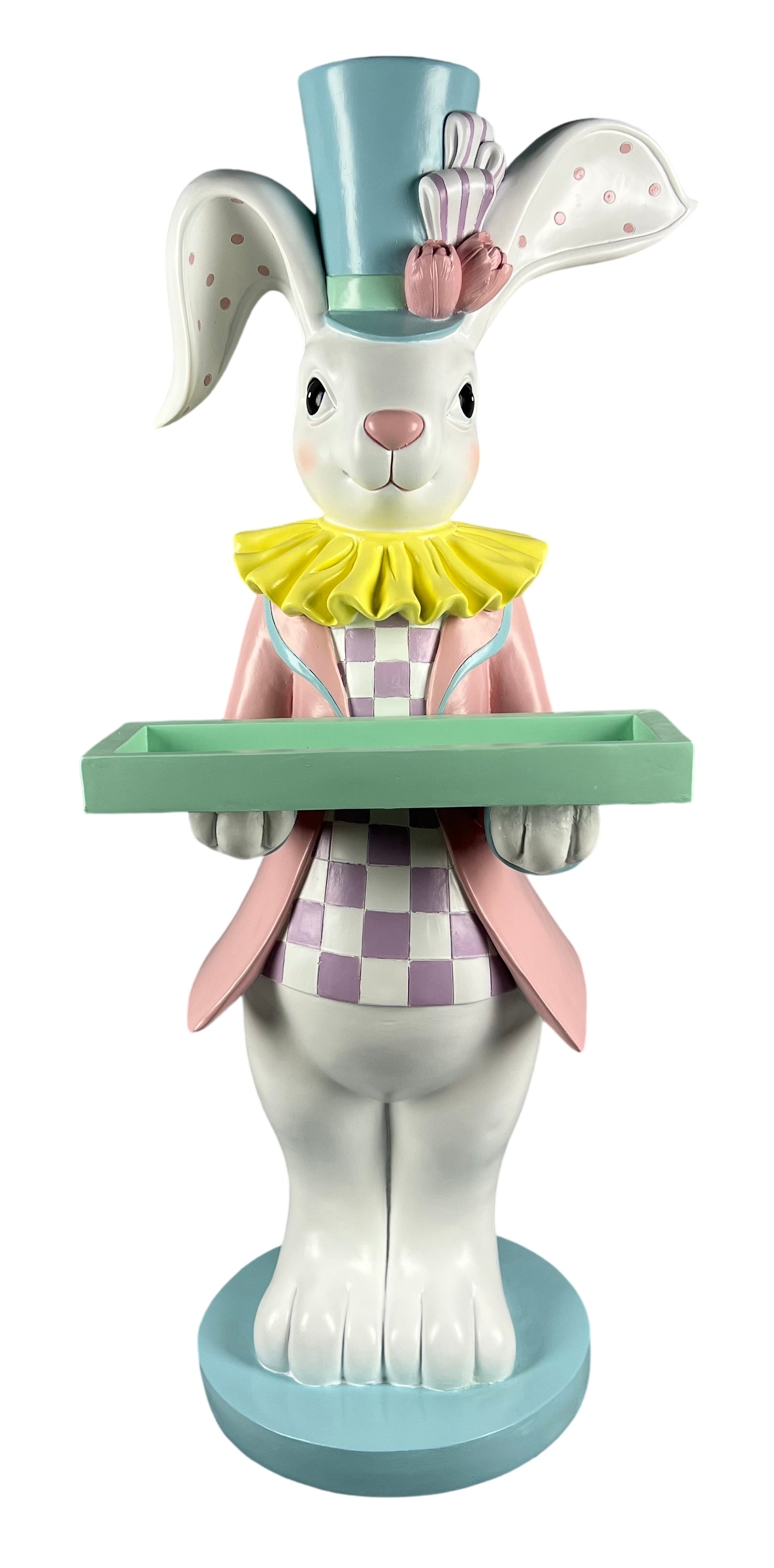 A decorative Easter bunny figurine wearing a light blue top hat with a pink bow, a yellow ruffled collar, and a pink-and-white checkered outfit, holding a mint green tray on a round blue base.