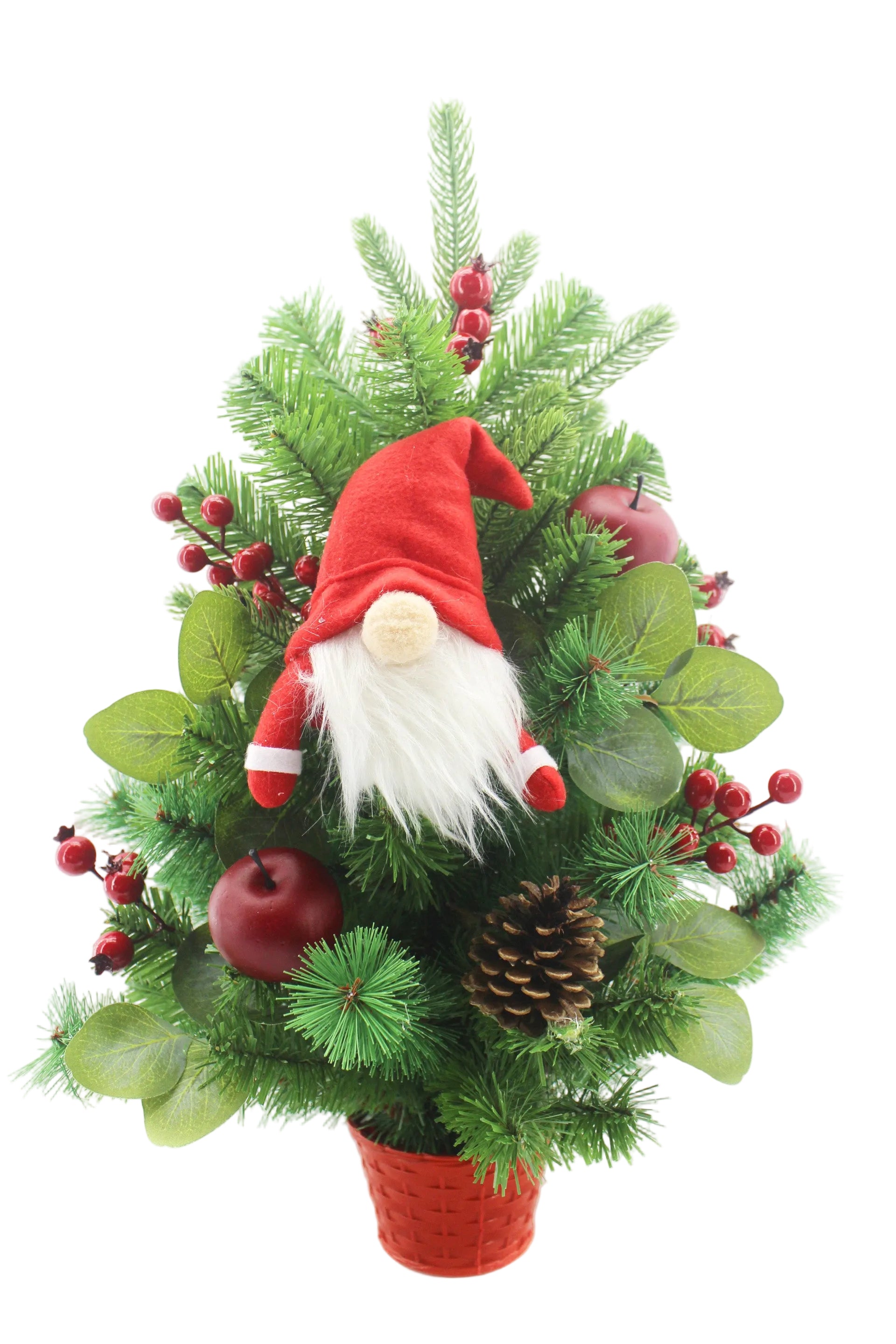 A festive artificial Christmas tree arrangement in a red pot, decorated with green pine needles, green leaves, red berries, red apples, and a plush gnome wearing a red hat and white beard.