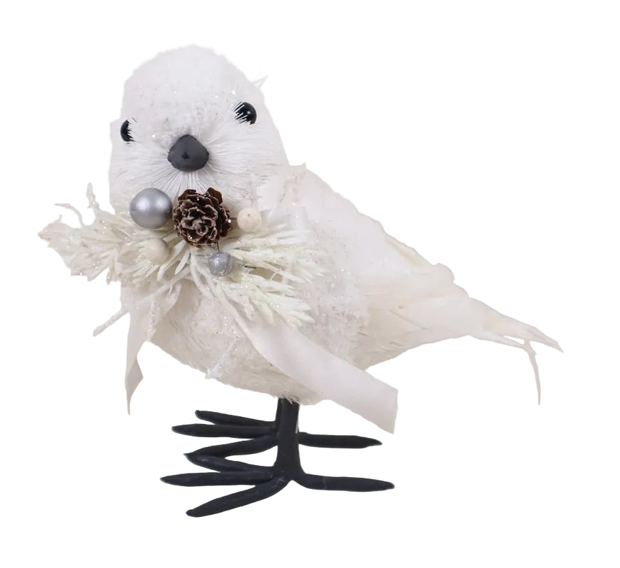 A white standing bird ornament with a floral decoration on its neck.
