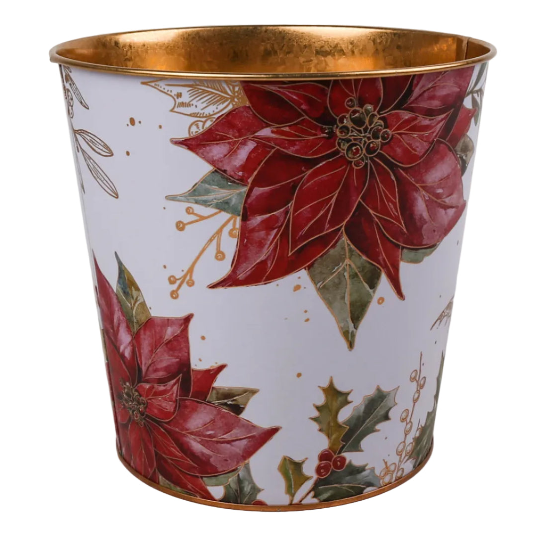 A white metal pot with a gold interior and base, decorated with red poinsettias, green holly leaves, and gold-toned botanical accents.