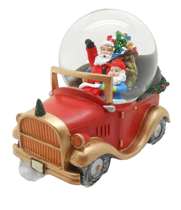 A decorative snow globe featuring Santa Claus sitting in a red and gold toy car with a Christmas tree.