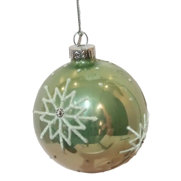 A green glass Christmas ornament with white glitter snowflake