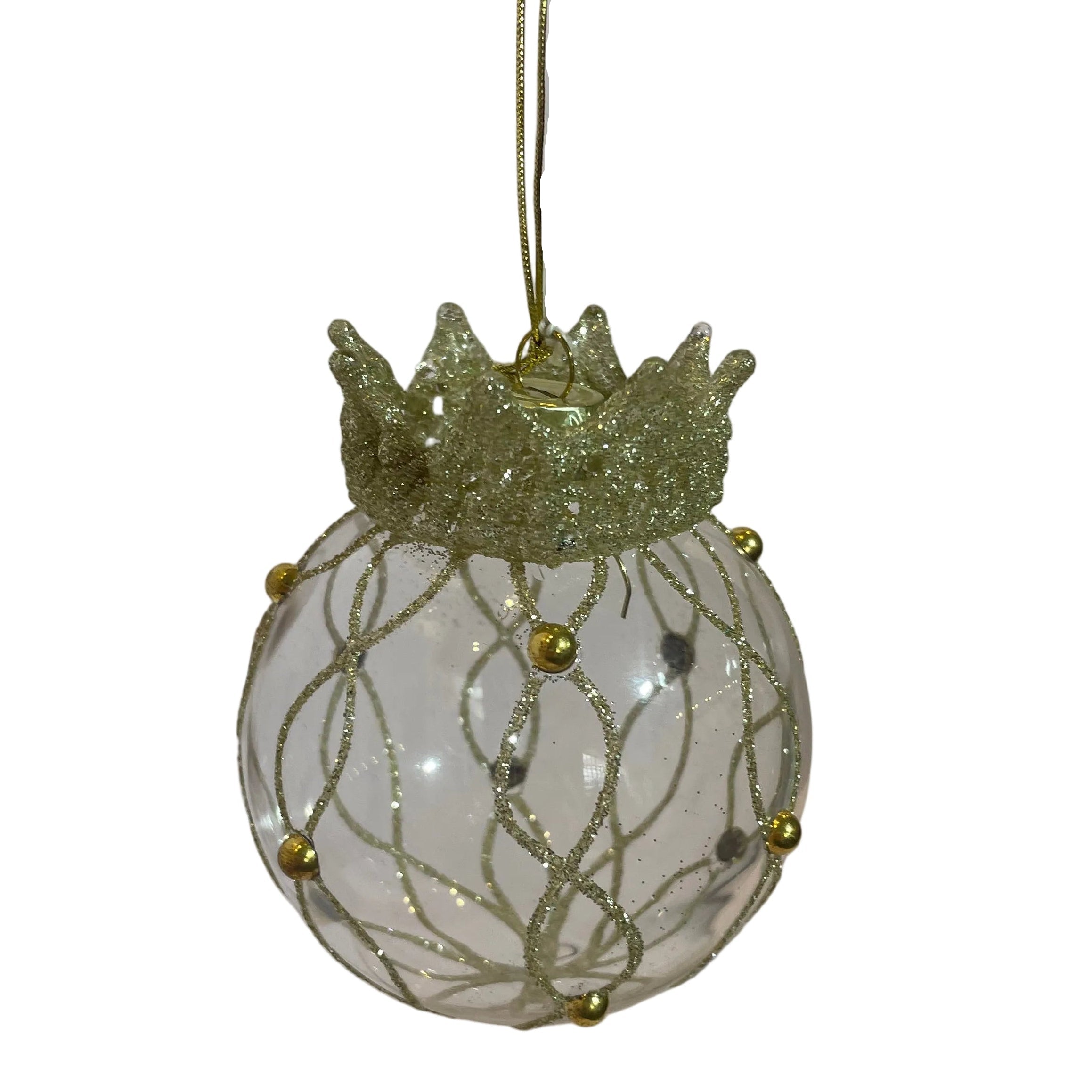 A clear glass Christmas ornament with a gold glitter crown and gold glitter waves