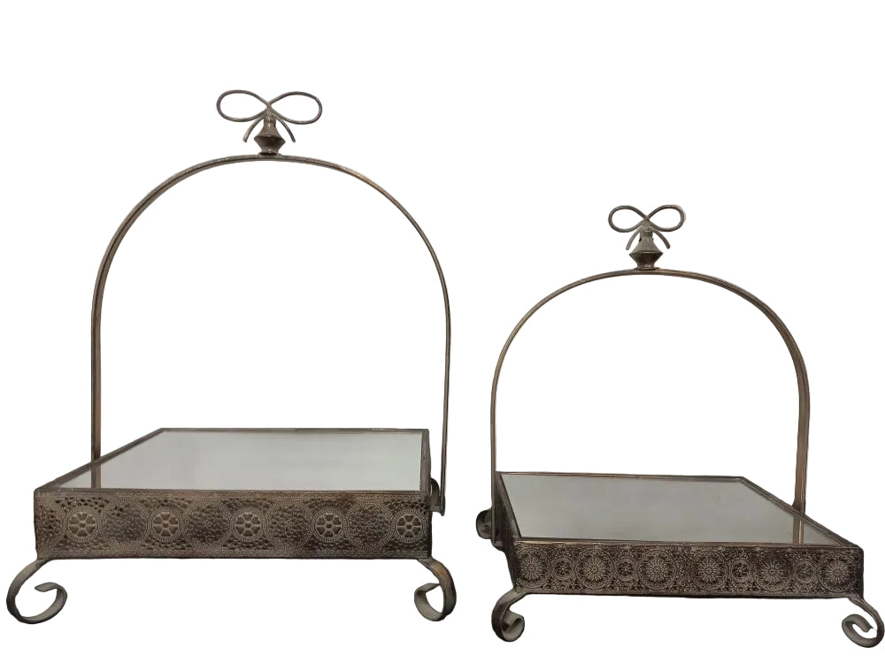 Two cake stands with mirrored surfaces and decorative handles, displayed against a neutral background.