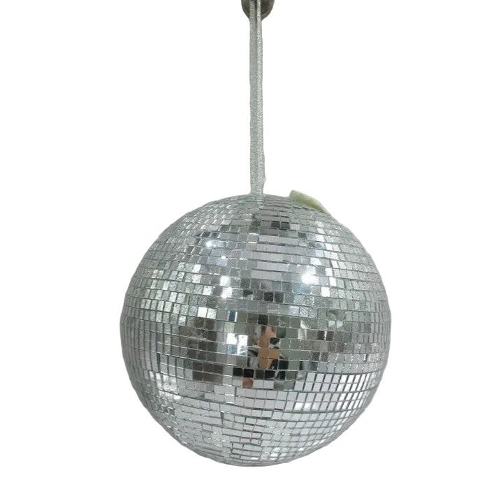Silver disco ball hanging against a white wall