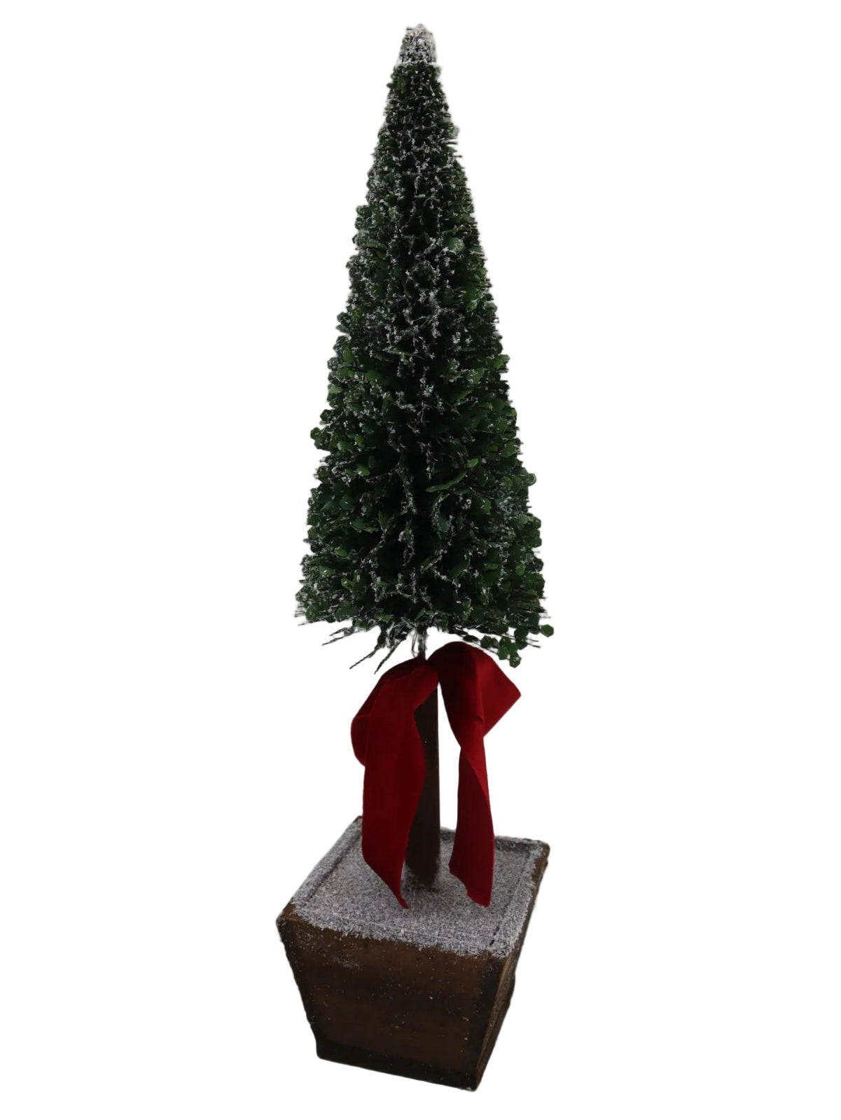 Small artificial Christmas tree with a red ribbon against a plain background