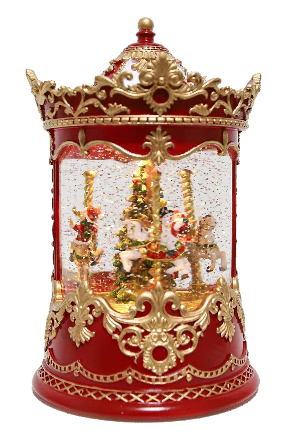 A musical red and gold Christmas carousel snow globe figurine featuring a miniature Christmas tree, and carousel horses inside a clear globe under an ornate gold crown lid.