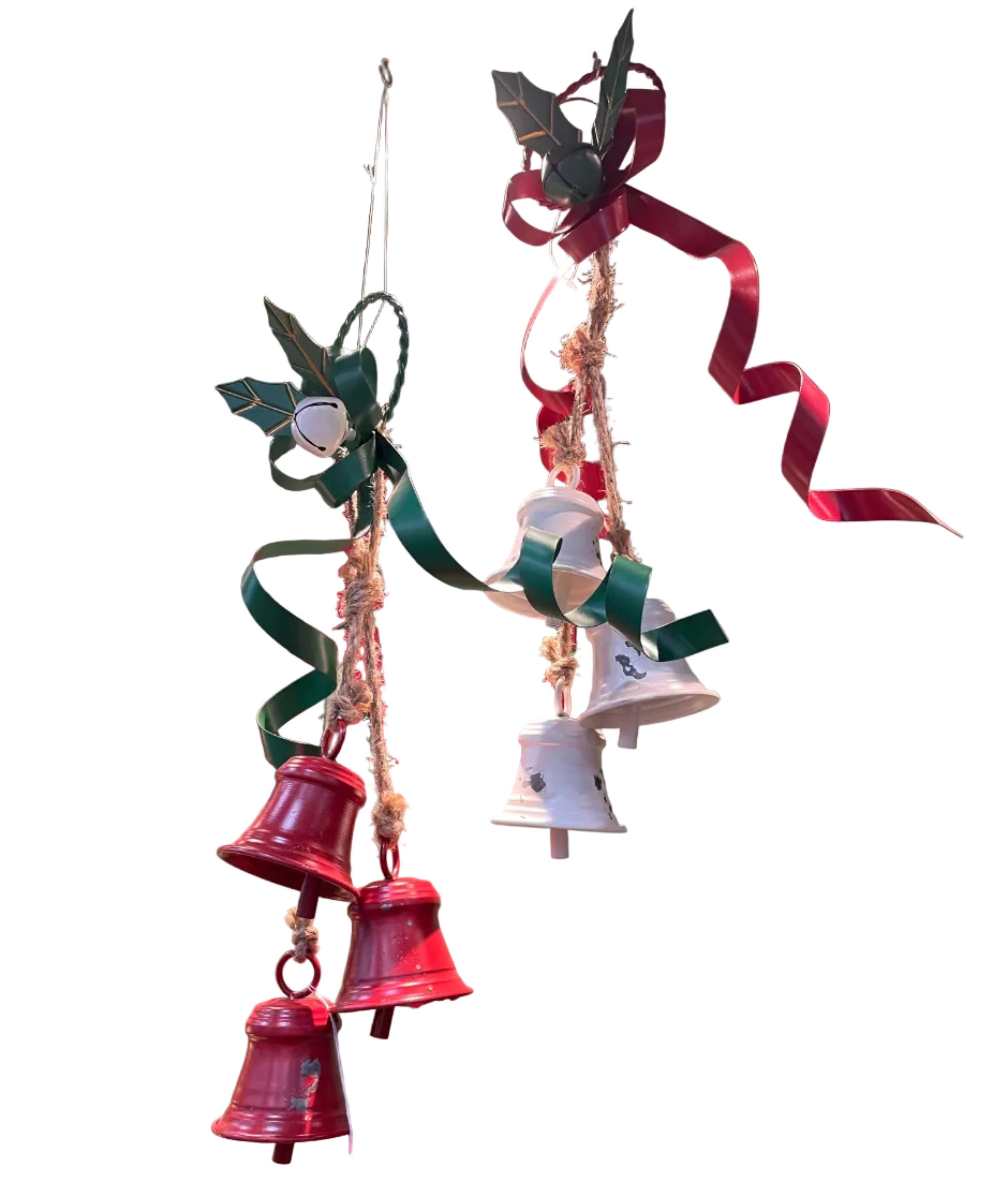 A hanging Christmas ornament set with red and white bells, green and red ribbons, holly leaves, and natural jute rope