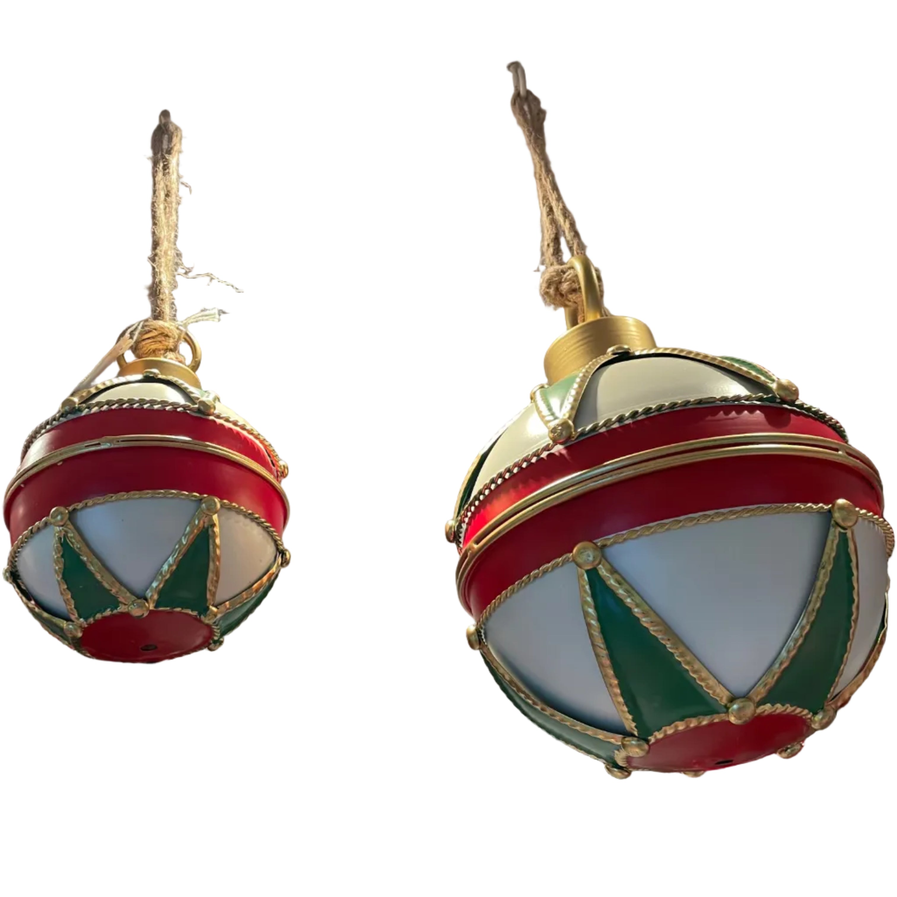 Two large hanging Christmas ornament decorations with red, white, and green sections and gold trim