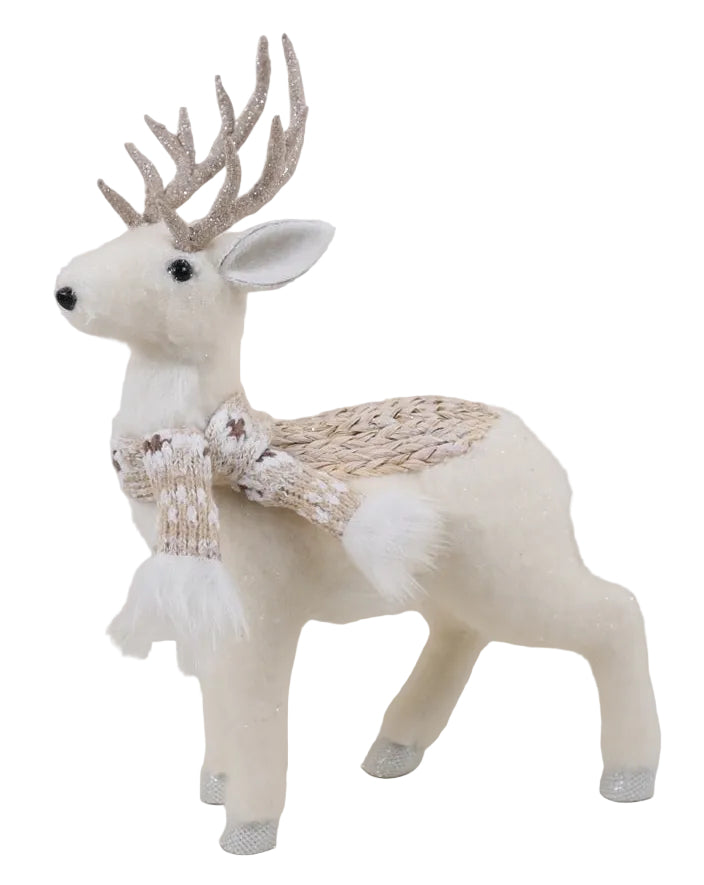 A decorative figurine of a deer with a brown scarf and white body, with ornate antlers.
