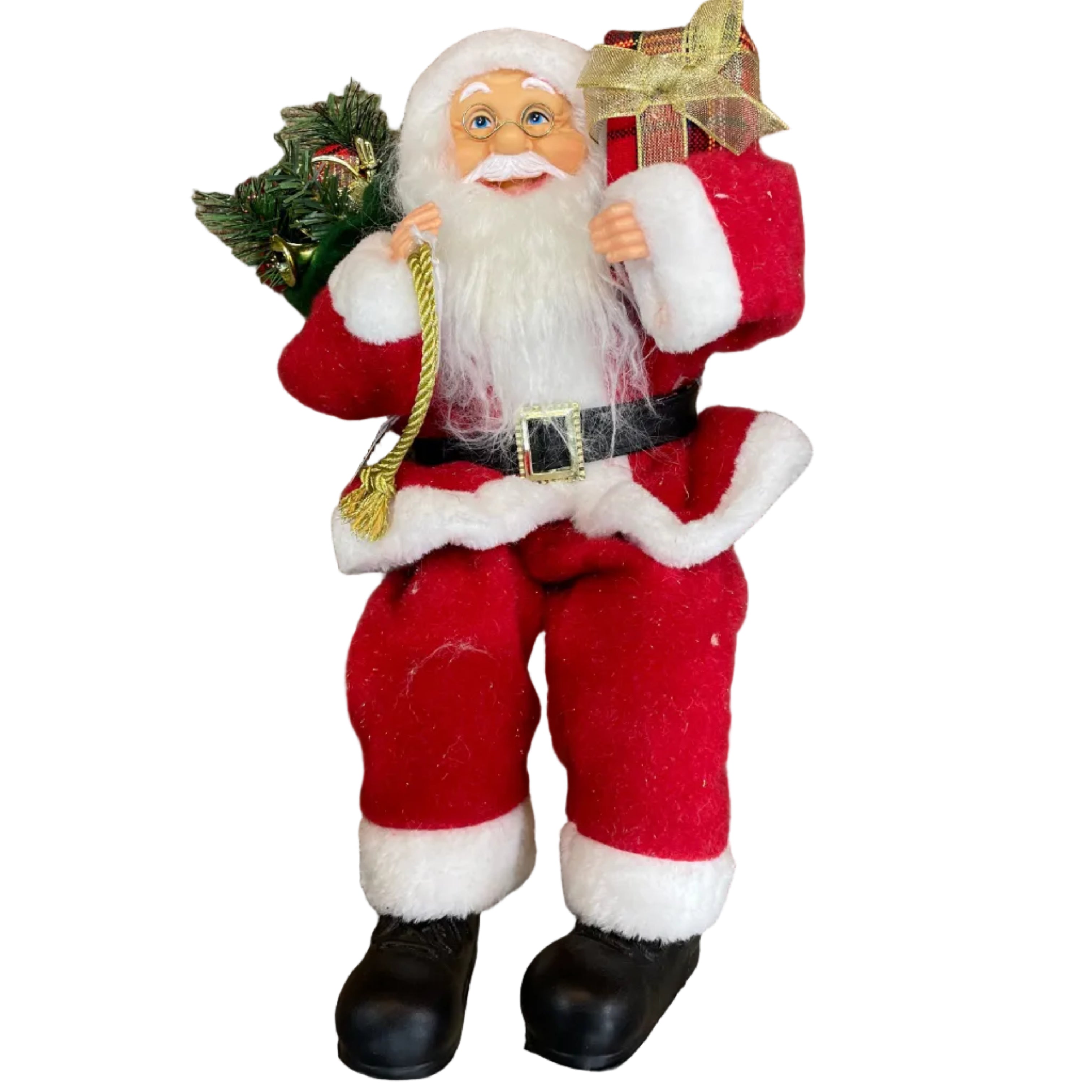 A Santa Claus figurine dressed in a red suit with white trim, black belt and boots, holding a small green present sack and a wrapped gift